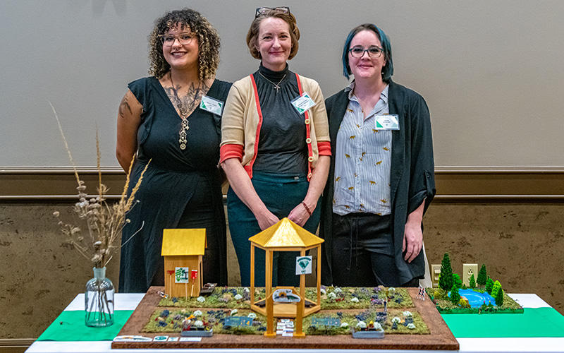 UNT ecology senior Chione (Kiwii) Lawton, Dr. Jaime Baxter-Slye and UNT ecology junior Kymie Creswell at the Diamond Eagles Project Reveal event in February 2023.