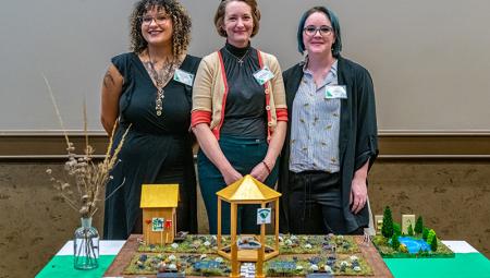 From left to right: UNT ecology senior Chione (Kiwii) Lawton, Dr. Jaime Baxter-Slye and UNT ecology junior Kymie Creswell at the Diamond Eagles Project Reveal event in February 2023.