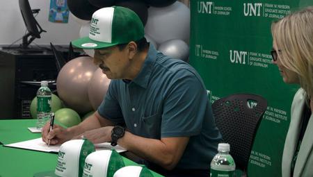 George Esquivel ('91) signs the new endowed scholarship into effect at a celebration event in May.