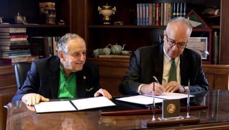 John Strauss (left) sitting alongside Dr. John W. Richmond (right), dean of the UNT College of Music, at a celebration event for the John and Bonnie Strauss Foundation's $1 million commitment to UNT's commercial music program.